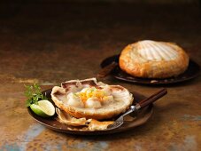 Two scallops baked in shells with Vermouth, chervil and lime
