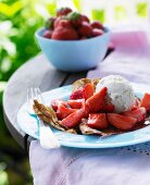 Crepes with fresh strawberries and ice cream