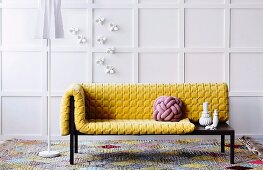 Yellow structured cushions and cushion made from interwoven cord on designer récamier