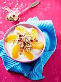 Yoghurt with orange segments and muesli