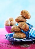 Small wholemeal bread rolls stacked in a tower