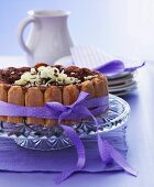 Charlotte with dark and white chocolate on a cake stand