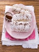 Meringues with coffee cream and cocoa powder