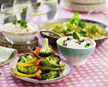 Baked pepper and broccoli medley on a laid table