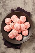 A bowl of strawberry meringues