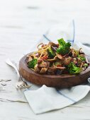 Fried mushrooms with noodles and broccoli