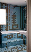 Bathroom tiled in imaginative patterns of blue and brown mosaic tiles