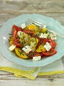 Tomato salad with feta cheese and chives