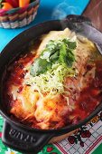Steaming enchiladas with cheese and coriander (Mexico)