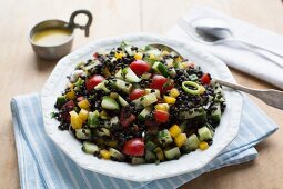 Beluga lentil salad with courgette, peppers, cherry tomatoes and vinaigrette