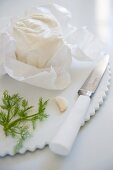 Goat's cream cheese, dill, garlic and a knife