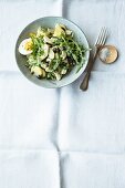 Artichoke and potato salad with rocket and egg