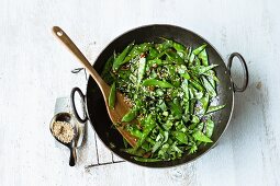 Stir-fried sesame seed mange tout with ginger, chilli and spring onions