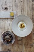 Cauliflower with mussels in a chamomile sauce and a mussel cream cake (a dish by the award-winning, Flemish chef Kobe Desramaults)