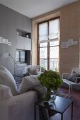 Living room with stone wall and period window