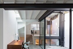 Home office in extension with glass walls