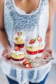 Panna cotta trifles with berry jelly for Christmas dinner