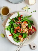 A colourful salad with fried scallops