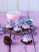 Mini chocolate muffins with purple butter cream