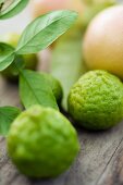 Keffir limes on a wooden board