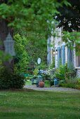 Section of idyllic garden with view of renovated country house