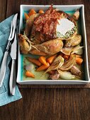 Stuffed turkey with bacon and oven-roasted vegetables