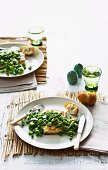 Crispy fish with peas and broad beans
