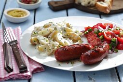 Chorizo with potato salad and tomato salad