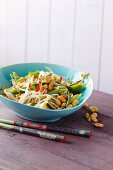 Fried mung bean sprouts with spring onions and peanuts