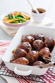 Chicken with a honey and soy glaze serve with oriental vegetables