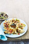 Gyoza with vegetables and sesame sauce (Asia)