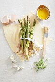 Ingredients for a puff pastry cake with green asparagus and Gorgonzola