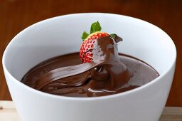 A chocolate wave with a strawberry