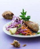 Chicken legs with a red cabbage salad