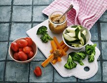 Homemade hummus with carrots, broccoli, tomatoes and courgette