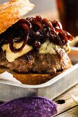 Grilled lamb burger with blue cheese and caramelised onions
