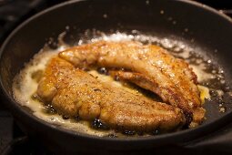 Spiced, fried allis shad roe in a pan