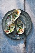 Gratinated oysters with pink pepper