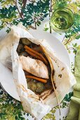 Chicken with courgette and carrots in parchment paper