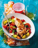 Salmon with a warm tomato salad