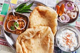 Chole bhatura and yoghurt (fried bread with a spicy chickpea sauce and yoghurt, India)