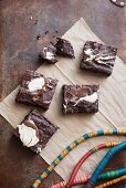 Chocolate and nut brownies decorated with melted chocolate