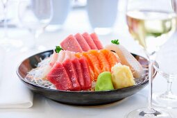 Raw fish sashimi with ginger and wasabi