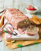 Rustic liver terrine served with grilled bread and radishes
