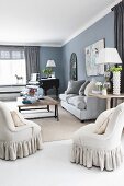 Elegant living room with upholstered furniture and black piano in background