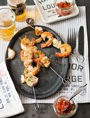 Grilled prawn skewers with salsa in a diner