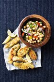 Chicken breast with a couscous crust and a chickpea salad