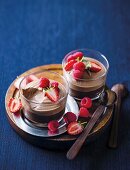 Bowls of chocolate mousse with fruit