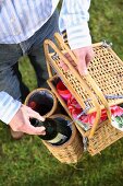 A picnic basket with wine