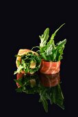 Two salmon rolls with avocado and rocket
